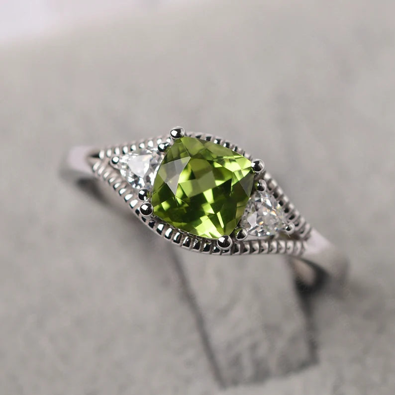 "Vintage-Inspired Green Cushion-Cut Gemstone Ring with Clear Accents