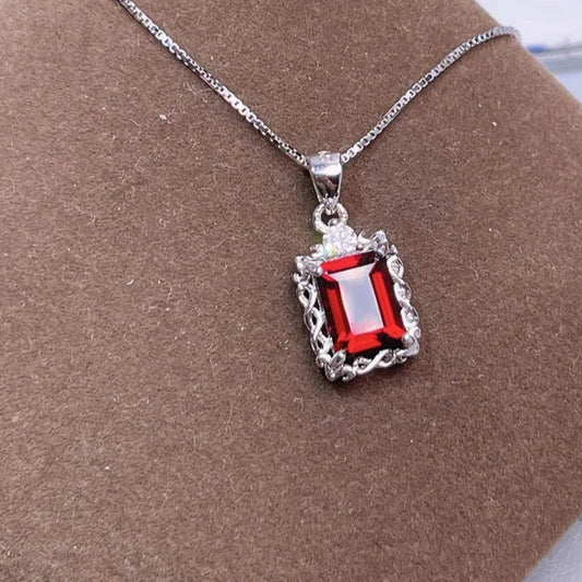 Emerald-Cut Red Gemstone Pendant and Vintage-Inspired Design